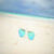 Macro of sunglasses on the beach sands Wallpaper  icon